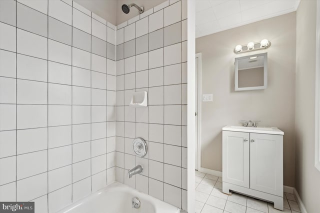 bathroom featuring tile patterned floors, vanity, tiled shower / bath combo, and ornamental molding