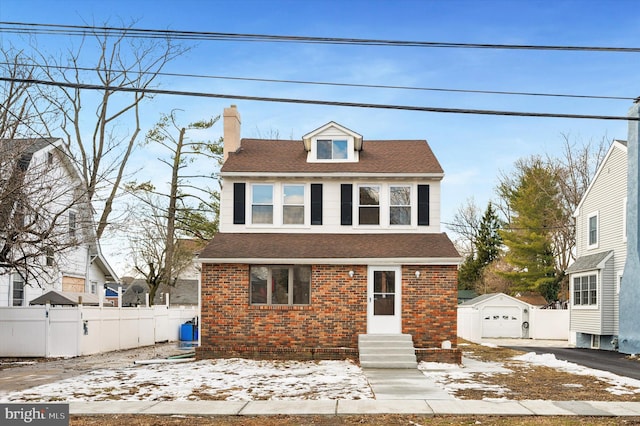 view of front of property featuring an outbuilding and a garage