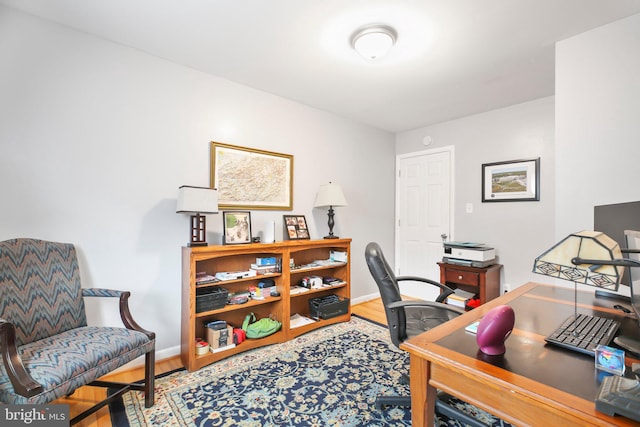 office space with hardwood / wood-style floors