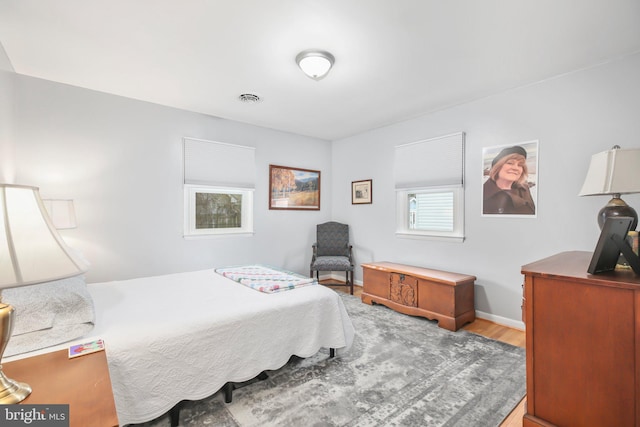 bedroom with light hardwood / wood-style flooring