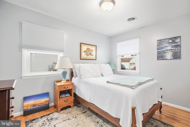 bedroom with wood-type flooring