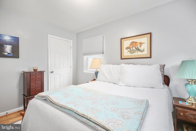 bedroom with wood-type flooring