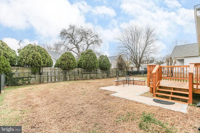 view of yard with a patio area and a deck