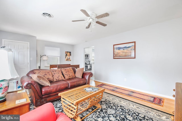 living room featuring ceiling fan