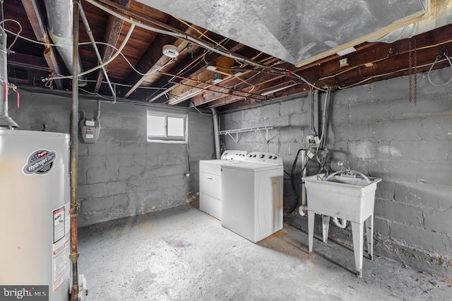 basement with sink, separate washer and dryer, and water heater