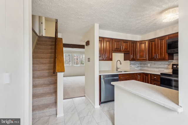 kitchen with backsplash, sink, light colored carpet, and appliances with stainless steel finishes