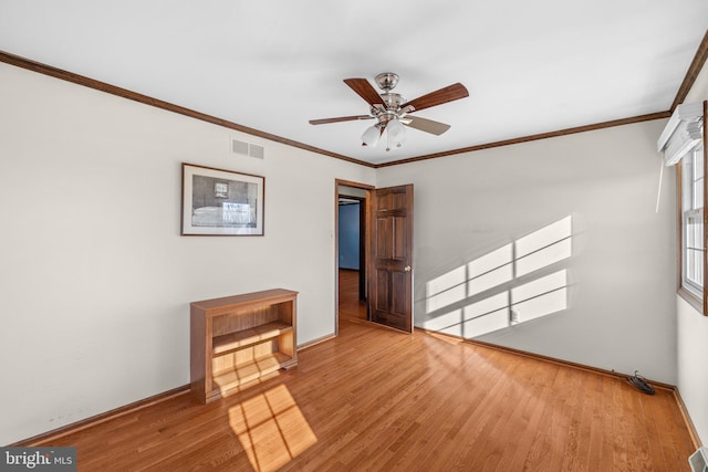 unfurnished room with hardwood / wood-style flooring, ornamental molding, and ceiling fan