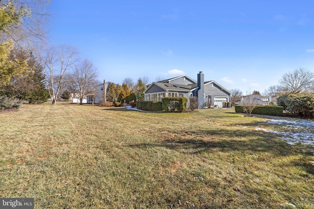 view of yard with a garage