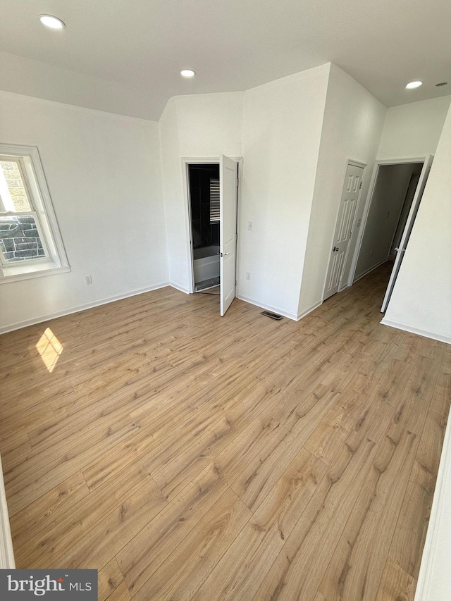 spare room with light hardwood / wood-style floors