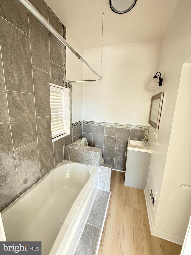 bathroom featuring vanity and hardwood / wood-style flooring