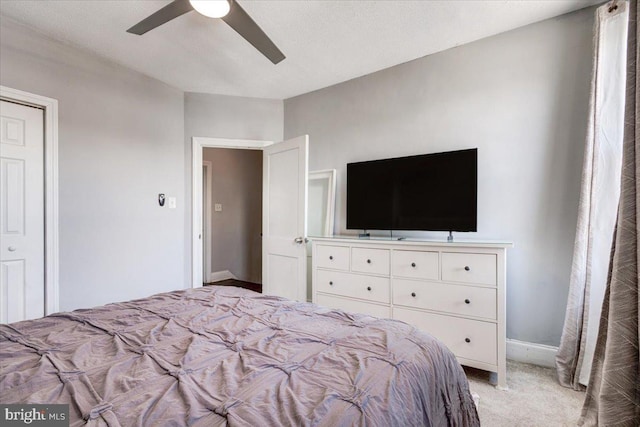 unfurnished bedroom featuring light colored carpet and ceiling fan