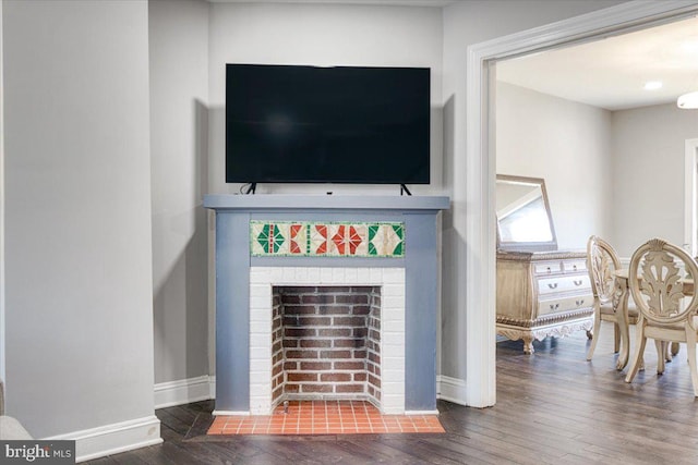 interior details with hardwood / wood-style flooring and a fireplace