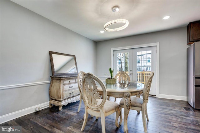 dining area featuring french doors and dark hardwood / wood-style floors