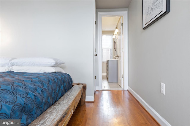 bedroom with hardwood / wood-style floors