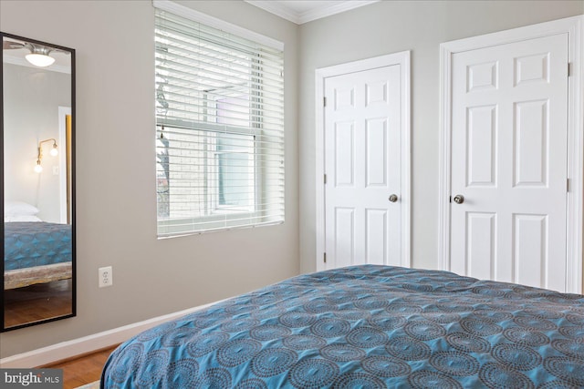 bedroom with crown molding