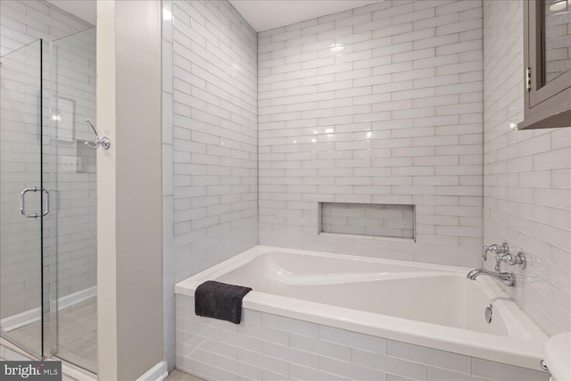 bathroom with separate shower and tub