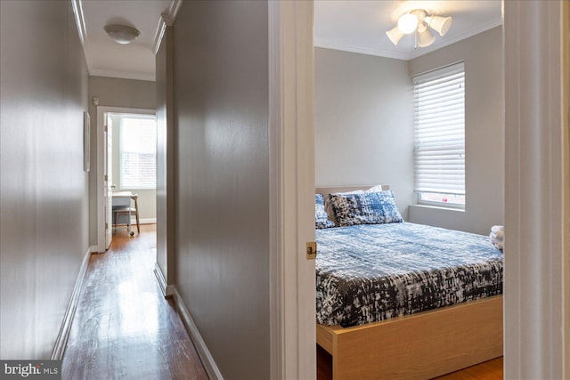 bedroom with ceiling fan, ornamental molding, and light hardwood / wood-style flooring