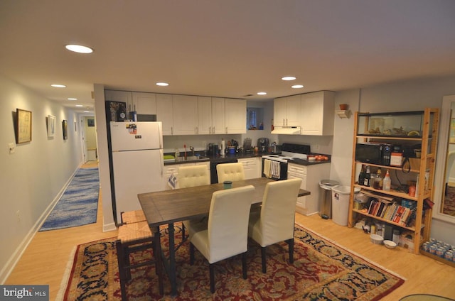 dining area with light hardwood / wood-style floors