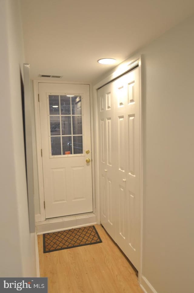 doorway to outside featuring light wood-type flooring