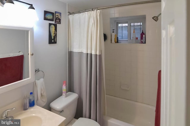 full bathroom with shower / bath combo, vanity, and toilet