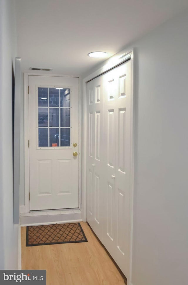 doorway to outside with light hardwood / wood-style floors