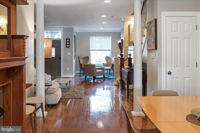 entrance foyer featuring dark hardwood / wood-style flooring and crown molding