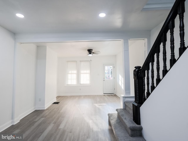 entryway with ceiling fan and hardwood / wood-style floors