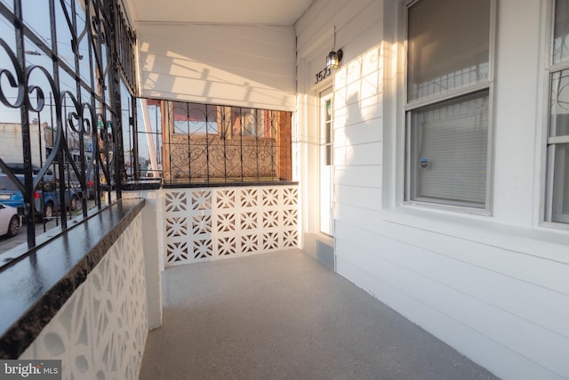 corridor featuring wooden walls