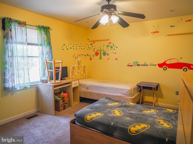 bedroom featuring a ceiling fan, carpet, visible vents, and baseboards