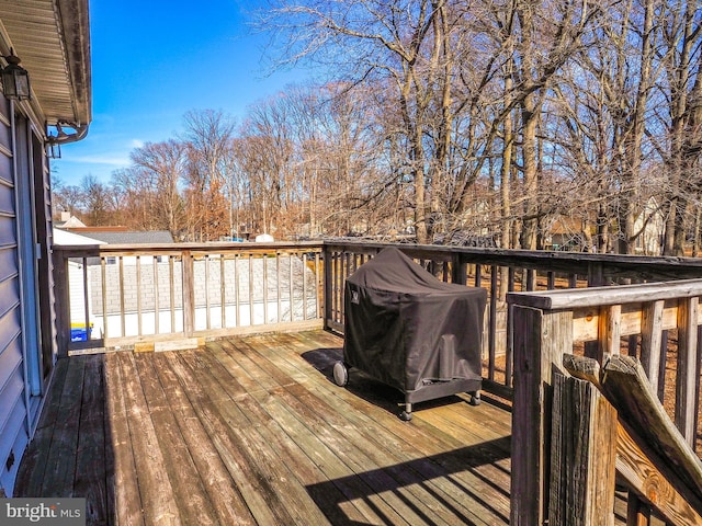 wooden deck with grilling area