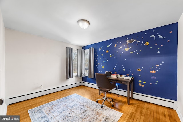 office area with hardwood / wood-style flooring and a baseboard radiator