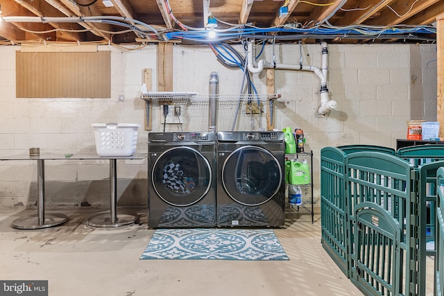 washroom featuring washer and dryer