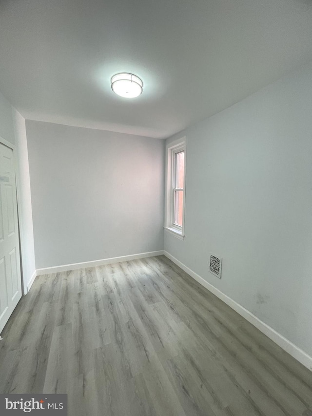 spare room featuring light hardwood / wood-style floors