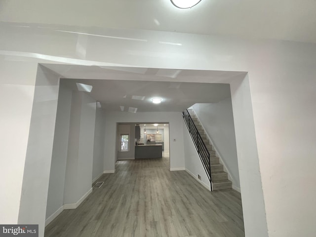 unfurnished living room with light hardwood / wood-style flooring