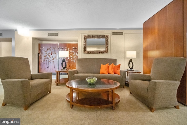 living room featuring visible vents and light colored carpet