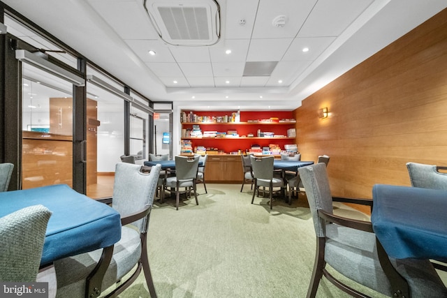 interior space featuring recessed lighting, visible vents, and wooden walls