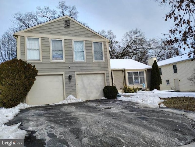 view of front of property with driveway and an attached garage