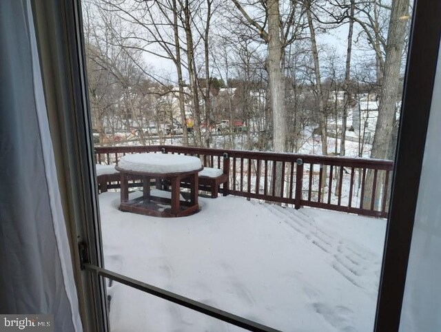 view of snow covered deck