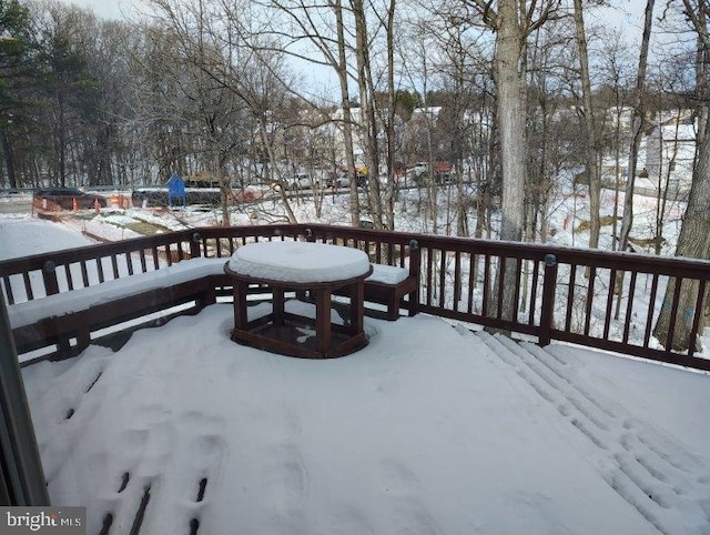 view of snow covered deck