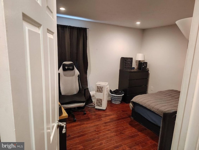 bedroom featuring dark wood-type flooring and recessed lighting