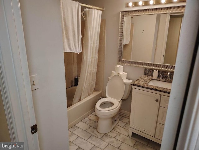 bathroom featuring toilet, shower / tub combo with curtain, and vanity