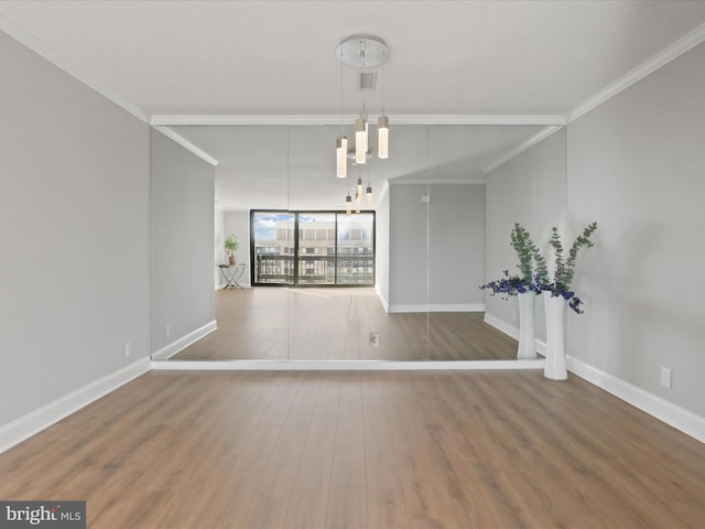 interior space with hardwood / wood-style floors, floor to ceiling windows, and crown molding