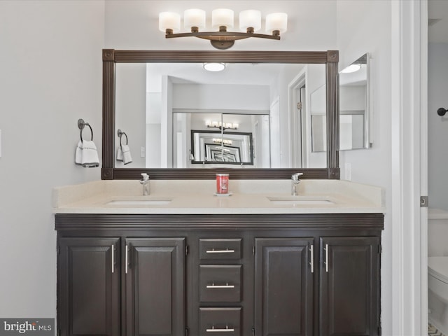 bathroom featuring vanity and toilet