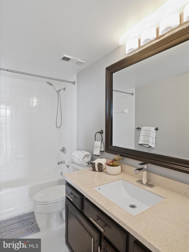 full bathroom featuring tile patterned flooring, bathtub / shower combination, vanity, and toilet