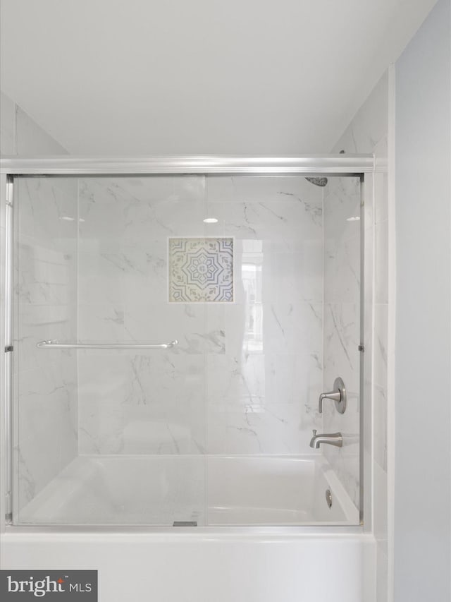 bathroom featuring enclosed tub / shower combo