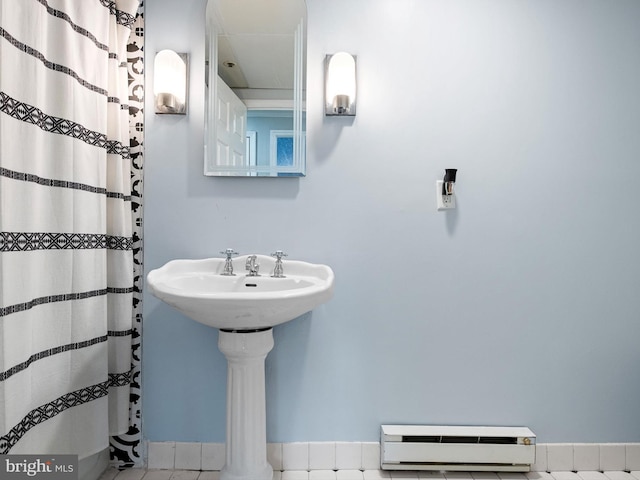 bathroom featuring tile patterned floors and baseboard heating