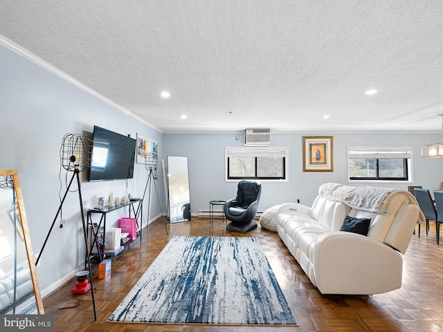 living room with a textured ceiling, parquet flooring, a wall mounted air conditioner, and ornamental molding