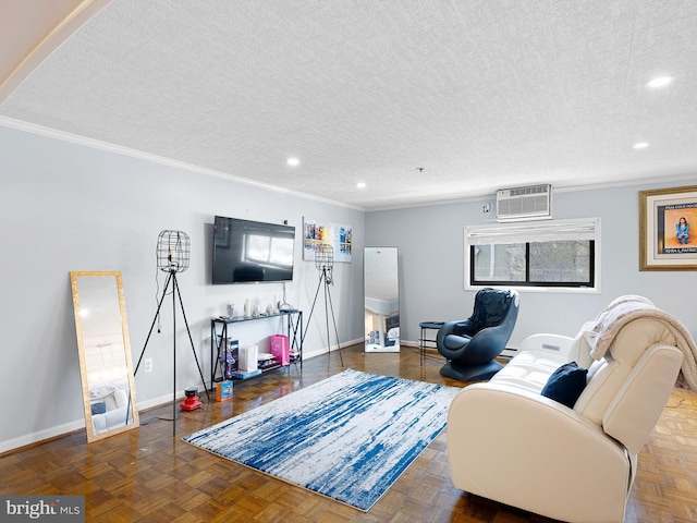 living room with a textured ceiling, a wall mounted AC, and ornamental molding