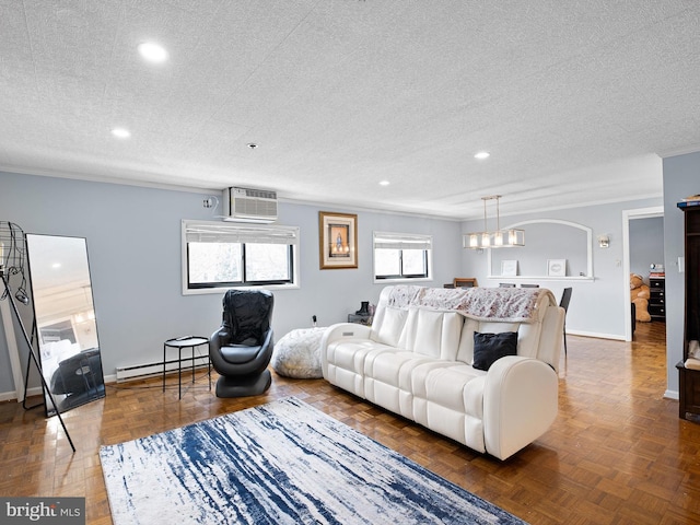 living room with a wall mounted AC, dark parquet flooring, a textured ceiling, and a baseboard heating unit