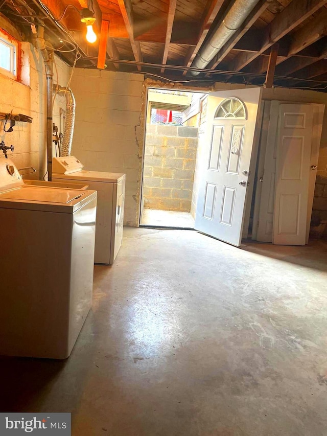 basement featuring washing machine and clothes dryer